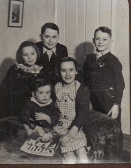 Betty Jane Pike, center, with brothers Dan (top) and Glenn (right), plus cousins Shirley and Kenneth in late 1930s as seen in Farm Journal with story about first dairy farm to use electricity