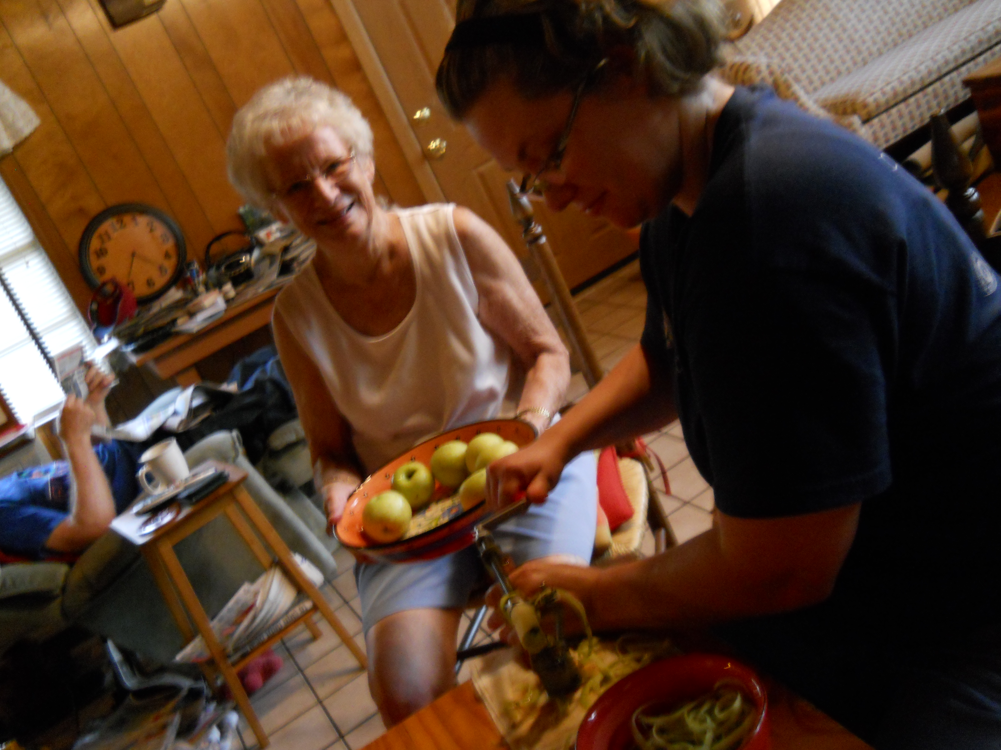 Betty Jane Keene and Courtney Patterson Baldwin peel apples
