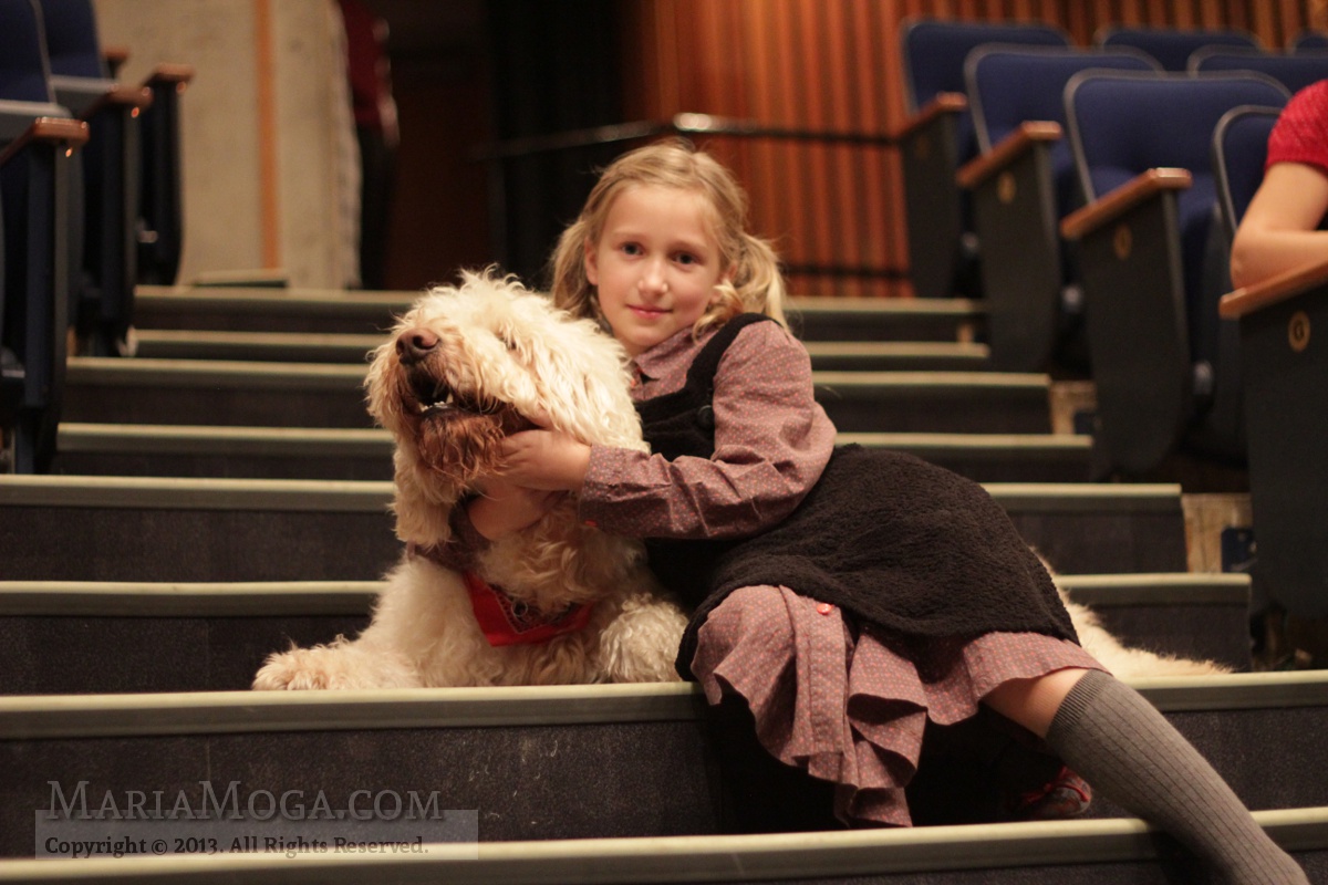 Maria Moga and her canine co-star on the stage of the musical Annie.