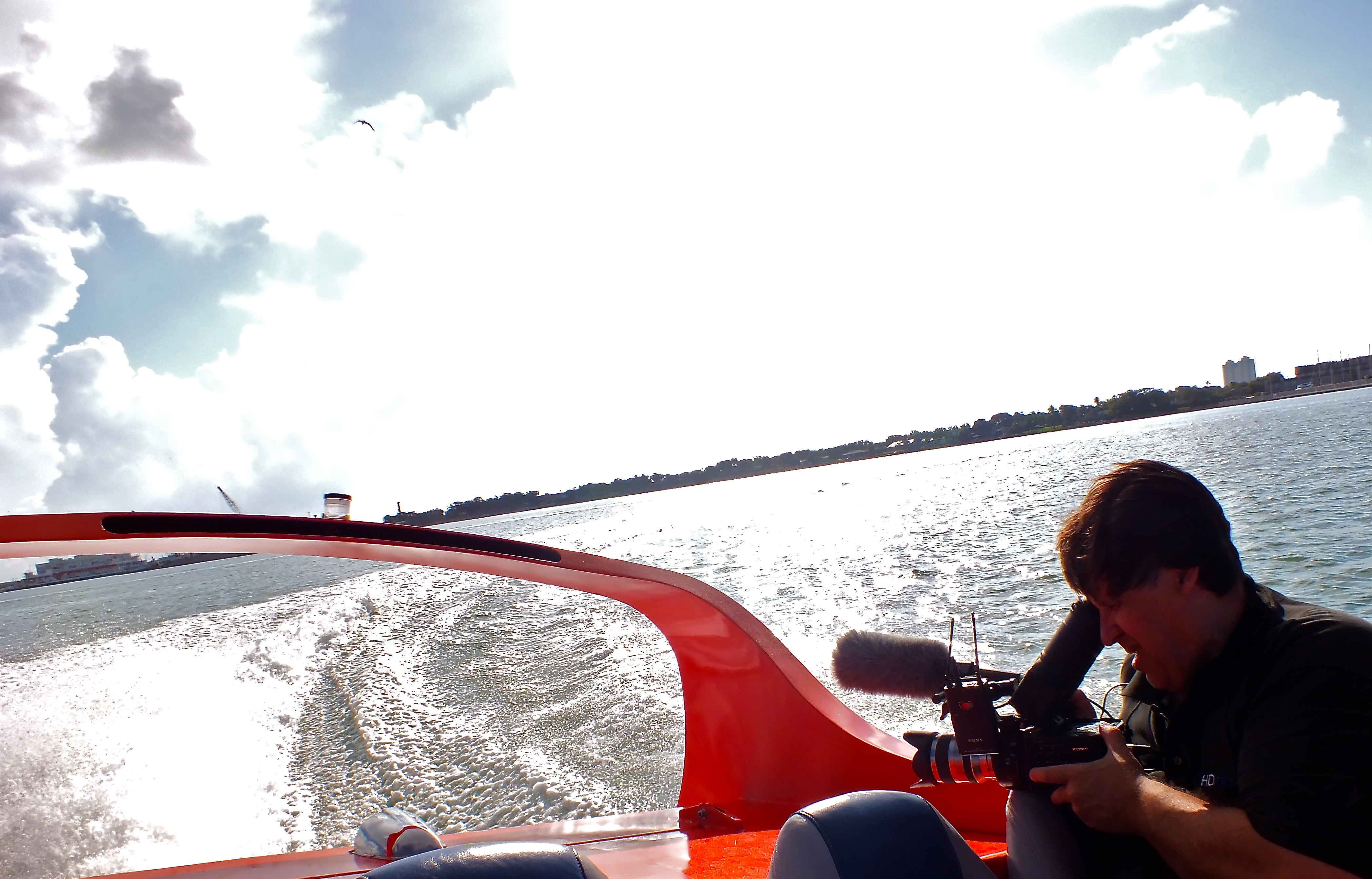 Filming the Galveston-Bolivar ferry aboard a jet boat for the movie, 