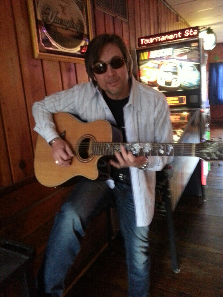 Just goofing off at a pool hall with the chefs cool guitar