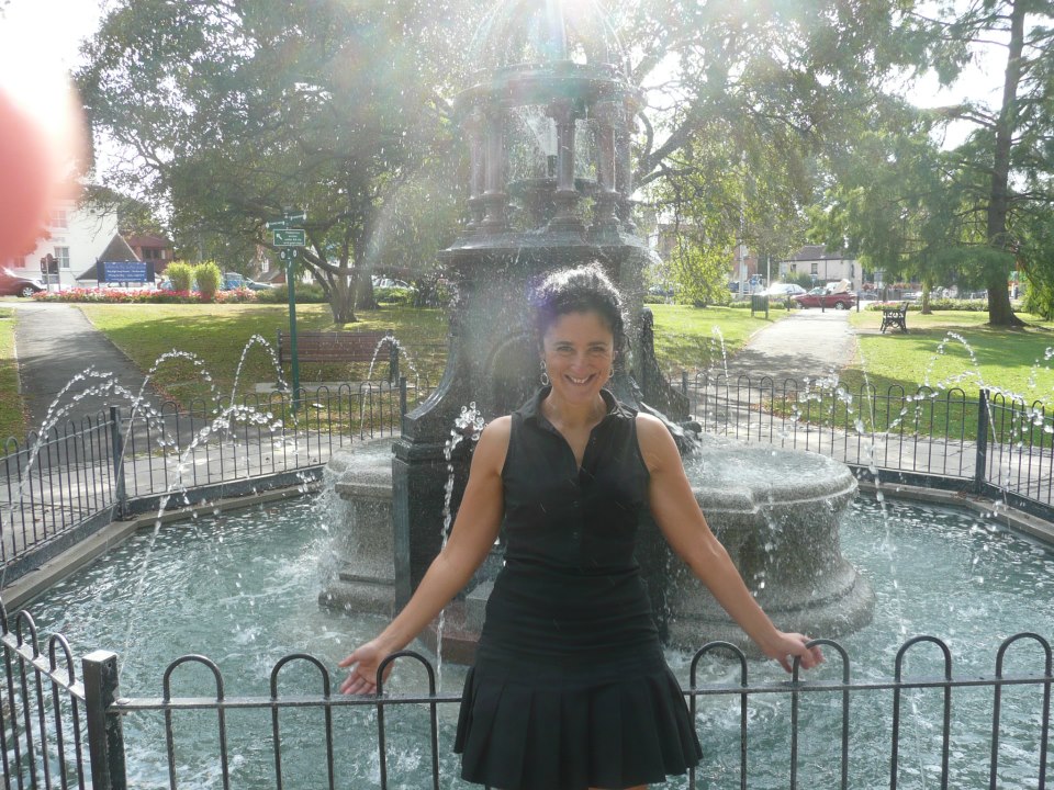 Mary Mallia basking in the light by the fresh fountain water