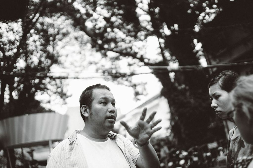 Quang Huy on the set of Chang Trai Nam Ay (2014). On the right corner is Huyen Coco (stylist) and Xu Xu (1st AD).