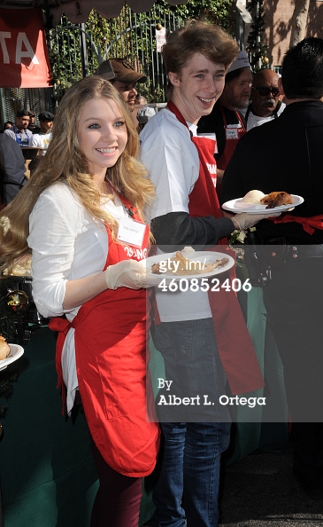 Elise Luthman and Joey Luthman serving dinner the Los Angeles Mission Christmas Eve Event for Skid Row Homeless LOS ANGELES, CA - DECEMBER 24: Actress Elise Luthman and actor Joey Luthman at the Los Angeles Mission Christmas Eve Event for Skid Row Homel