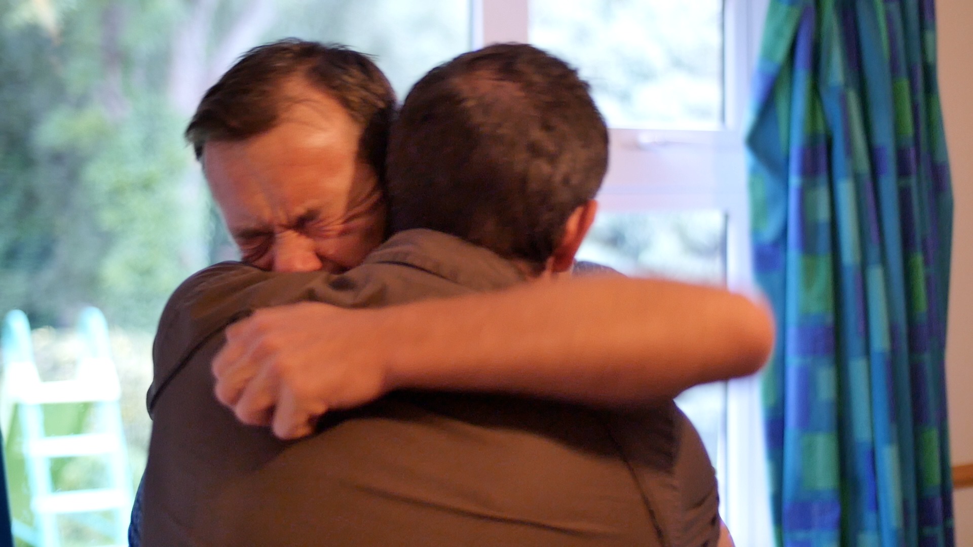 Characters James and Steve Baker hug it out