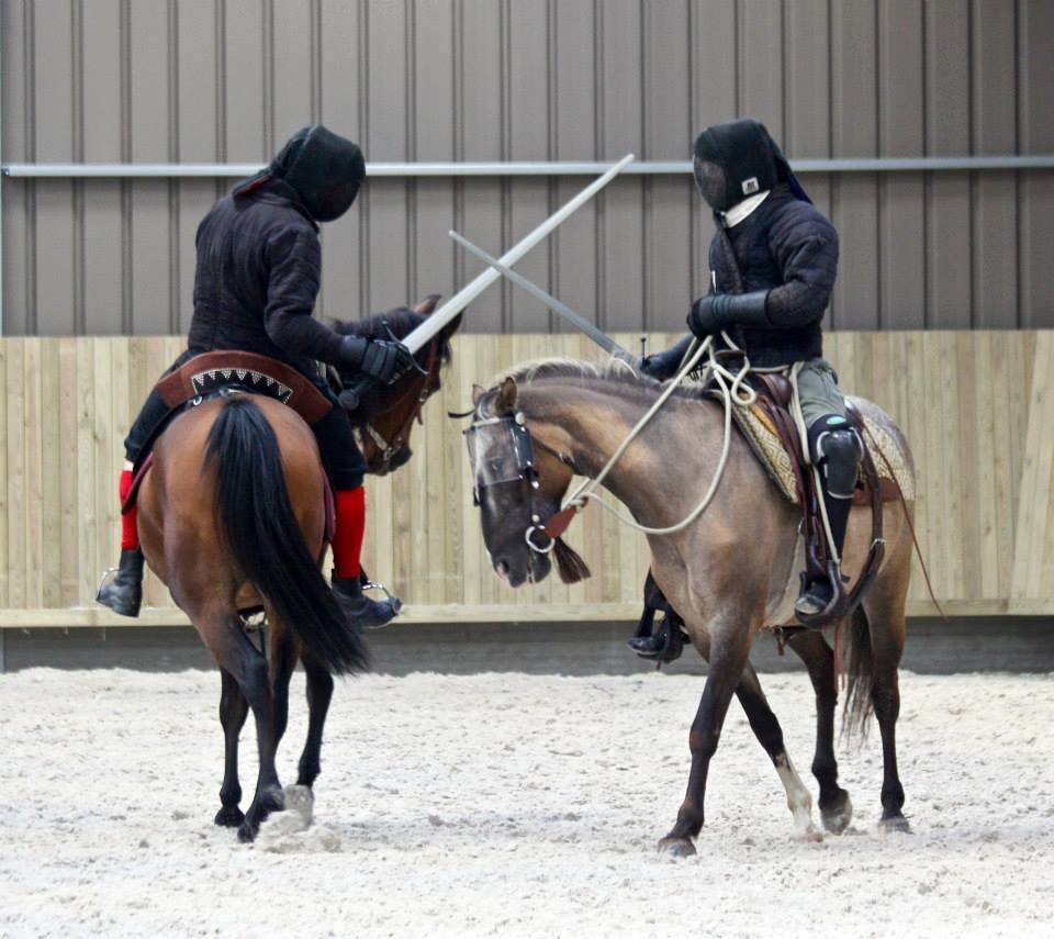 the calm before the storm, circling swords crossed and horses collected waiting for one to make a move.