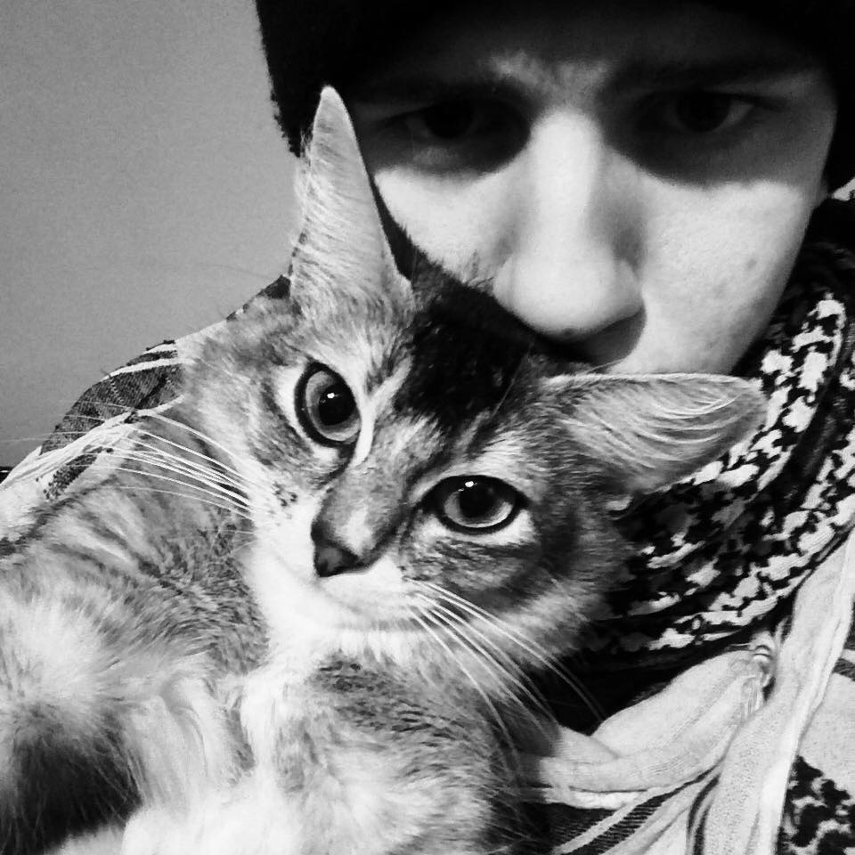 César with his cat, Pixel.