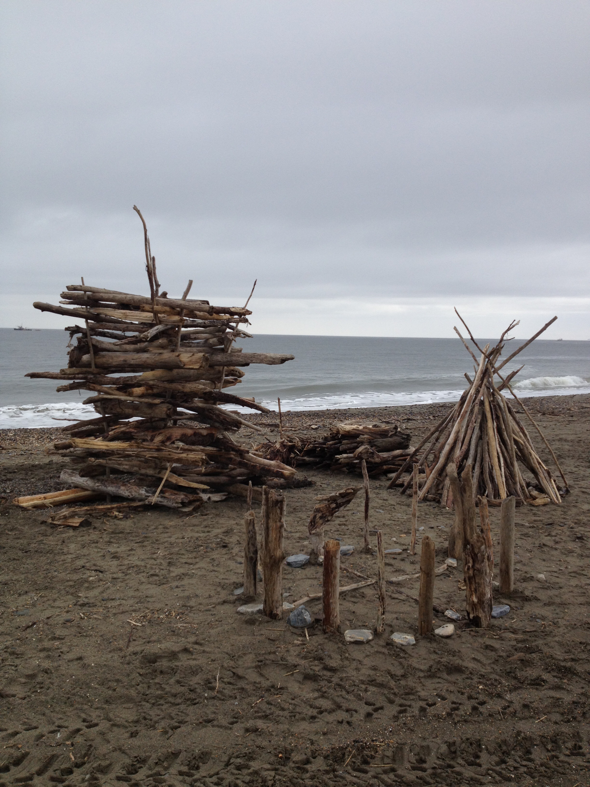 On the beach up in Alaska twenty miles from Russia making a bomb fire of drift wood.