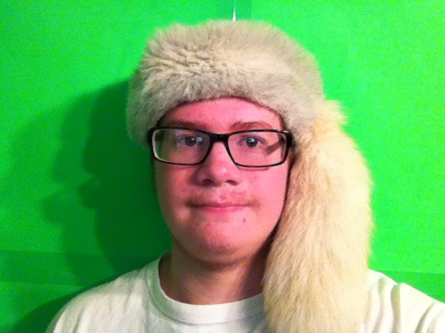 Ryan wearing his white fox fur hat.