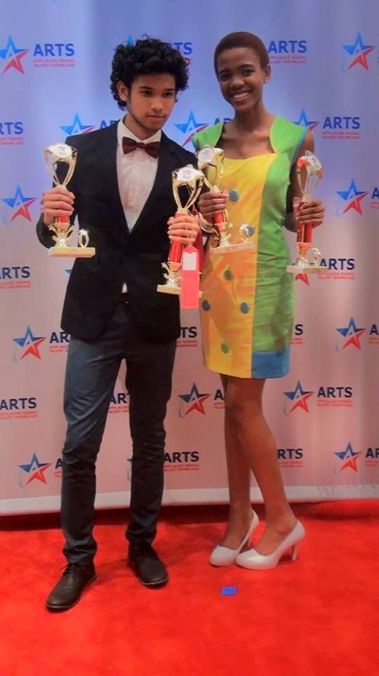 Applause Rising Talent Showcase in Orlando Florida. Anele holding her trophies.