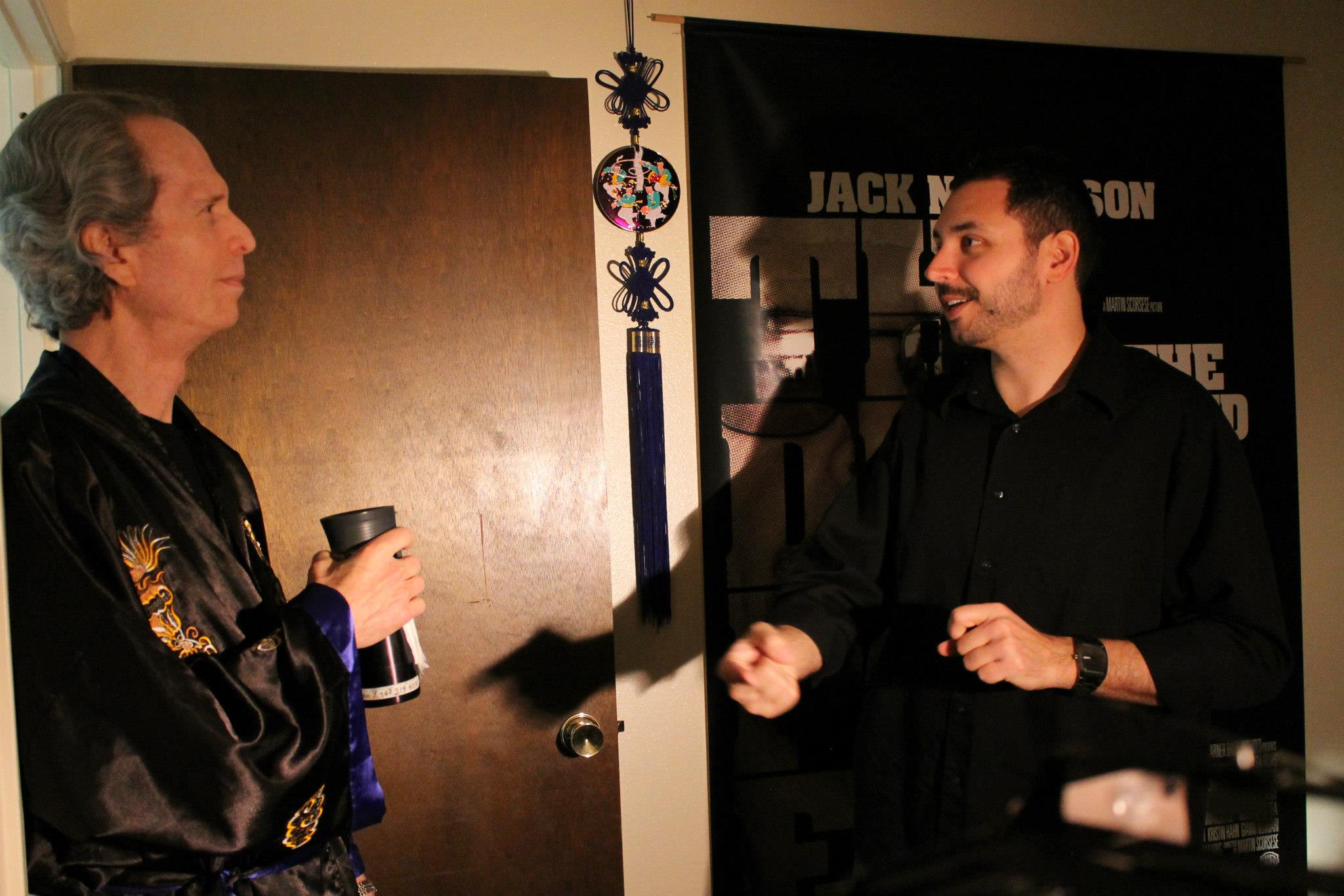 Discussing the scene with actor Don Yannacito, during filming of THE RETURN OF THE DRAGON SWORD.