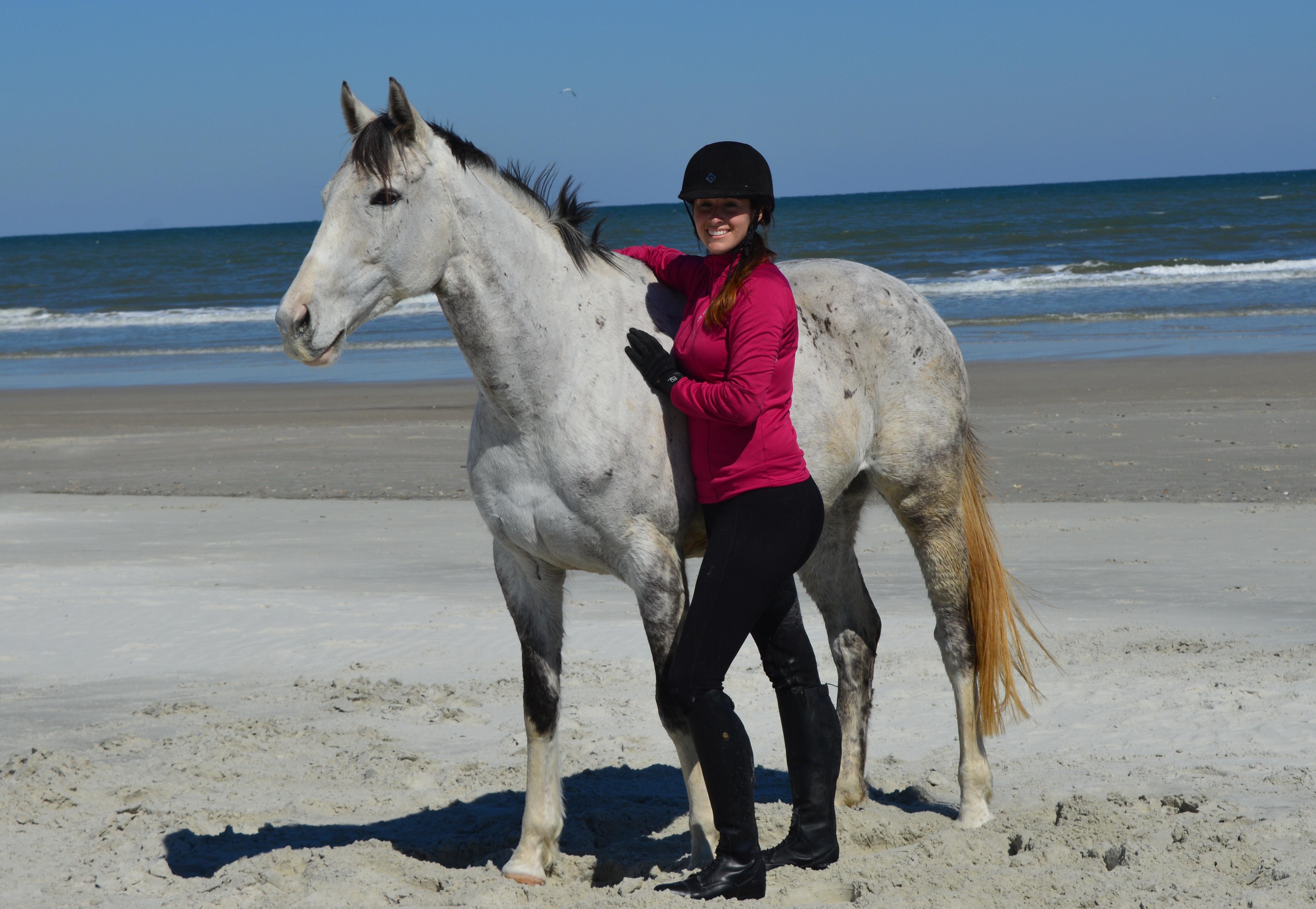 Lindsey with 'Soar' her 2015 Thoroughbred Makeover winner at the beach in Florida during a photo shoot.