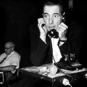 Humphrey Bogart phoning home during a break from filming The Enforcer 1951 Warner Bros