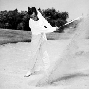 Playing golf circa 1949