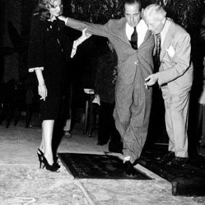 Humphrey Bogart, Lauren Bacall, and Sid Grauman, circa 1946.