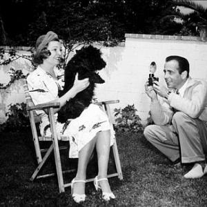Humphrey Bogart and his third wife Mayo Methot with their dog circa 1944