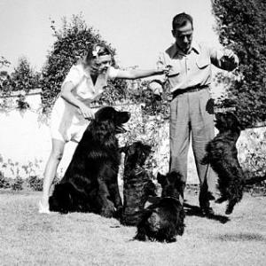 Humphrey Bogart and his third wife, Mayo Methot, with their dogs at home, 1944 Warner Bros.