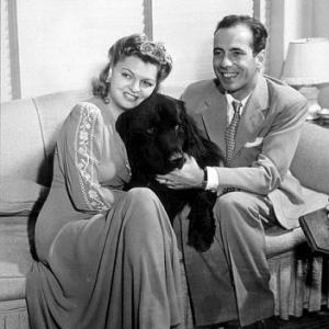 Humphrey Bogart and his third wife, Mayo Methot, with their black Newfoundland dog, 