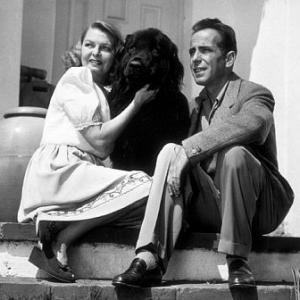 Humphrey Bogart and his third wife, Mayo Methot, with their black Newfoundland dog, 