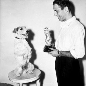 With his dog and a dog award, circa 1934.