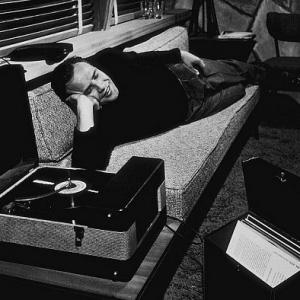 Marlon Brando listening to records at home