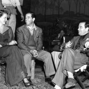 Bette Davis with directors Frank Capra and William Wyler. 