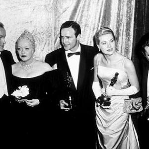 Grace Kelly at 1954 Academy Awards with B. Hope, B. Davis, M. Brando and E. O'Brien