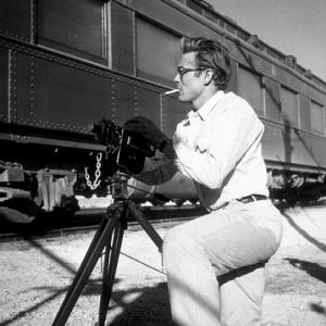 James Dean with his Bolex camera on location for Giant in Marfa TX 1955