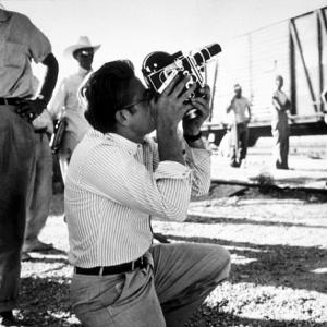 James Dean with his Bolex camera on location for Giant in Marfa TX 1955