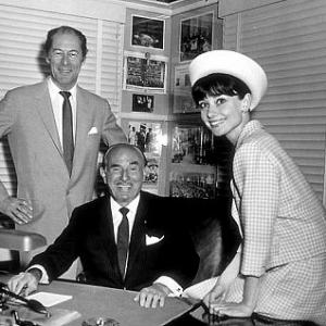 33311 Audrey Hepburn and Rex Harrison of My Fair Lady visits Jack Warner in his office