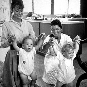 331137 Audrey Hepburn holds son Sean Ferrer while Dorothy Willoughby holds son Chris