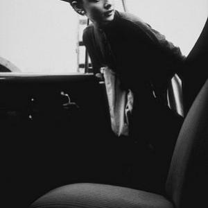 Audrey Hepburn getting into her car after a photo session at Paramount, 1953.