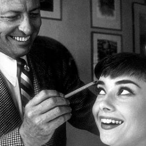 332334 Audrey Hepburn with Wally Westmore as he prepares her for her first publicity shoot at Paramount