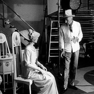 360446 My Fair Lady Audrey Hepburn listens to Cecil Beaton describe how he wants her to pose