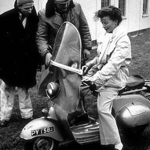 722-1112 Katharine Hepburn with wardrobe man Johnny Hilling on the set of 