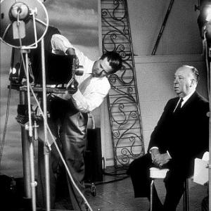 Alfred Hitchcock and photographer Gabi Rona c 1955