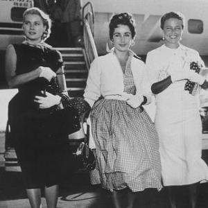 Elizabeth Taylor, Grace Kelly and Loraine Day arriving in New York September 2, 1954