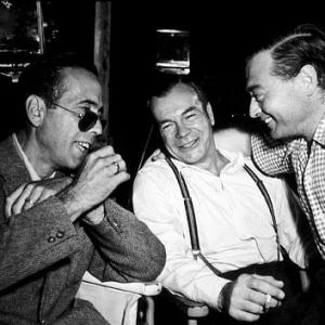 Humphrey Bogart, Gordon Carveth, and Peter Lorre on the set of 