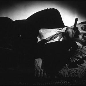 Groucho Marx lying down on a couch for 