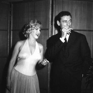 M. Monroe & Yves Montand at a press party for 