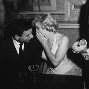M. Monroe & Yves Montand at a party for 