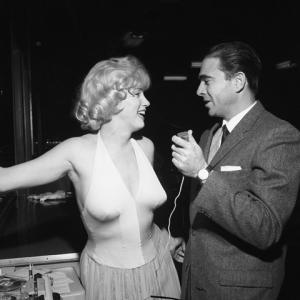 Marilyn Monroe and Army Archerd at a party for 