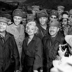 Marilyn Monroe with Gen. R. Hogaldoom and Col. W.K. Jones after a show give for more than 10,000 Marines, 1954.