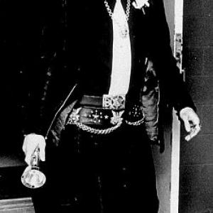 Elvis Presley arriving in Memphis Tennessee for the wedding of Chief Security Officer Delbert Sonny West Jr 121870