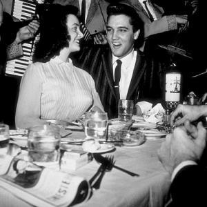 Elvis Presley with a friend at the Moulin Rouge in Hollywood, circa 1964.