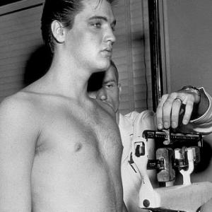 Elvis Presley weighing in during his induction into the army 1958