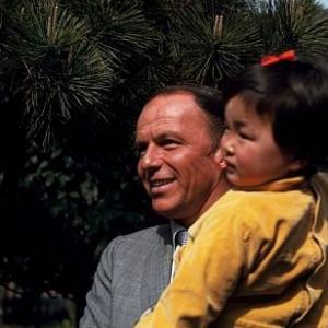 Frank Sinatra visits Japanese orphans during his childrens charities tour 1962  1978 Ted Allan