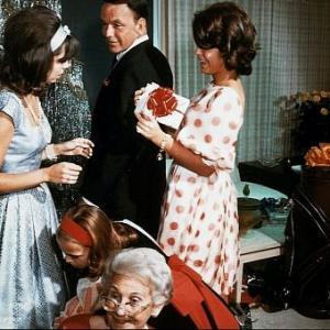 Frank Sinatra celebrating Christmas at home with daughters Nancy and Tina c.1965 © 1978 Ted Allan