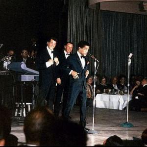 Frank Sinatra performs with Dean Martin and Sammy Davis Jr c1960