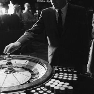 Frank Sinatra spins the roulette wheel at the Sands Hotel in Las Vegas